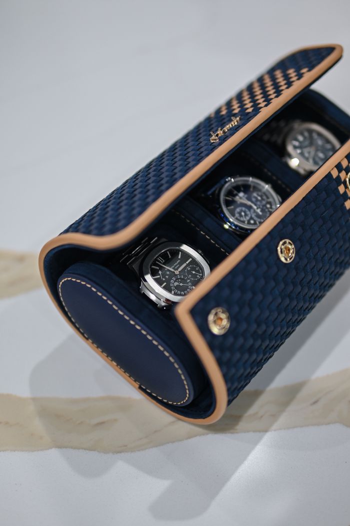 Home Luxurious watches in an elegant blue and gold case, showcasing style and wealth.